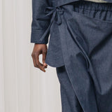 denim pants with ruffles and deconstructed drape piece