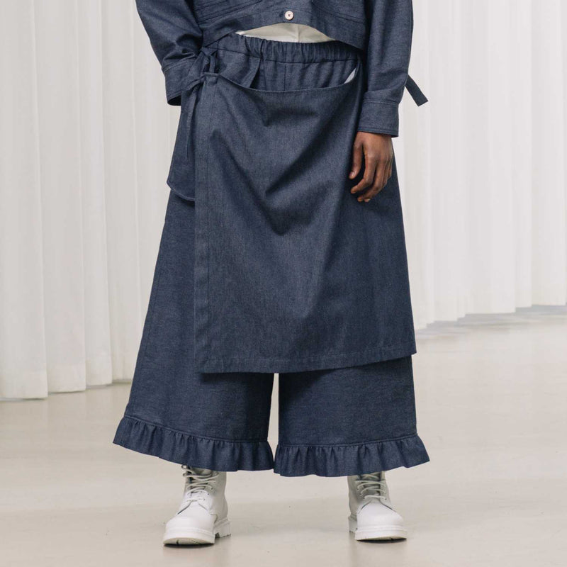 denim pants with ruffles and deconstructed drape piece